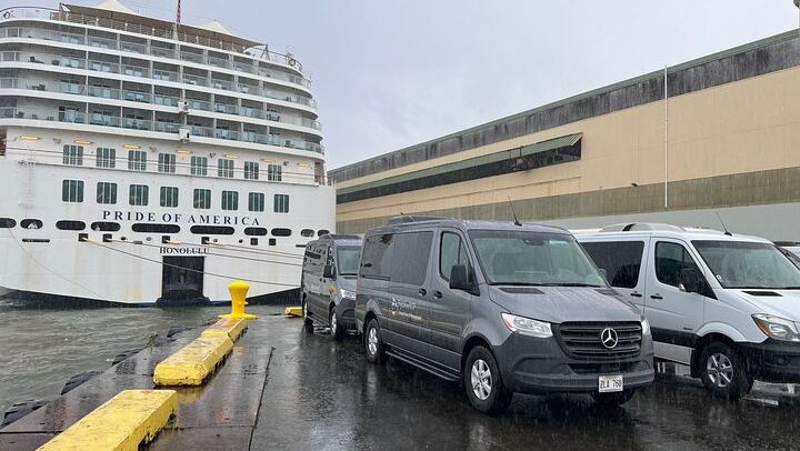 3 of our vans next to the Pride of America.