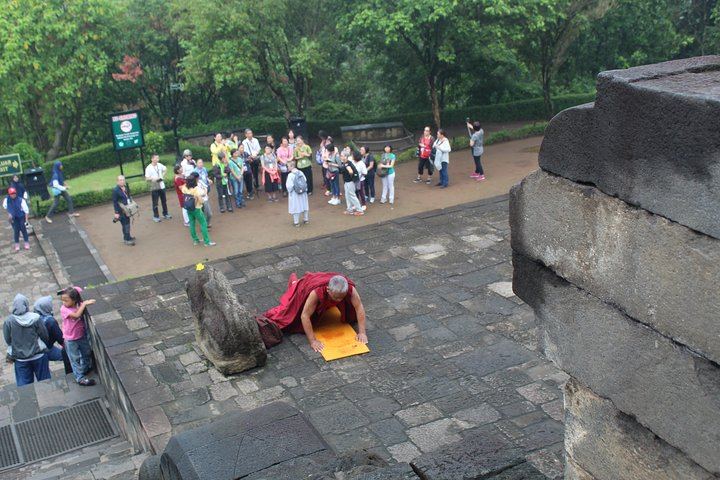 A Mahayana monk praying at Borobudur temple
