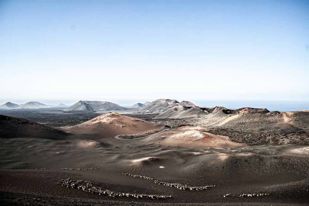 Aerial view of the volcanic craters and lava fields of Timanfaya National Park in Lanzarote, Canary Islands