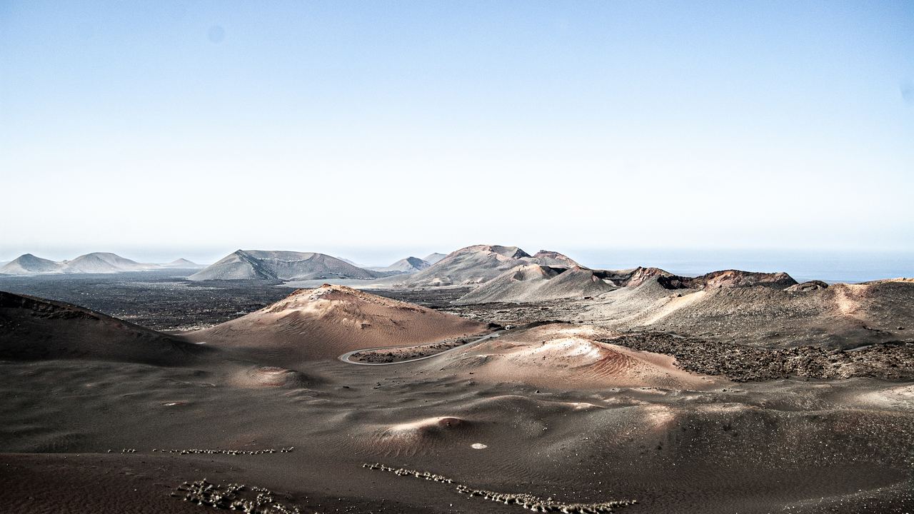 Aerial view of the volcanic craters and lava fields of Timanfaya National Park in Lanzarote, Canary Islands