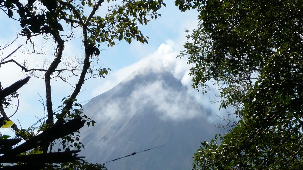 The Arenal volcano seen across the forest canopy from the hanging bridges circuit, Costa Rica