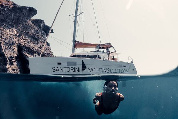 Catamaran from Ammoudi to Vlychada, with the BBQ Cooked Aboard