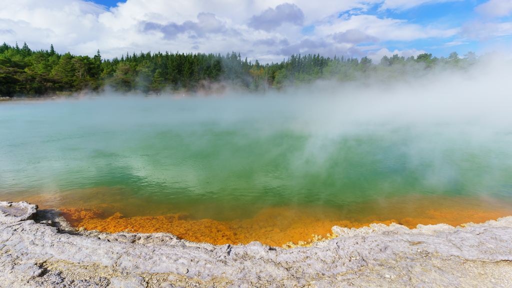 The Champagne Pool in the Wai-O-Tapu geothermal area near Rotorua, with an orange mineral rim