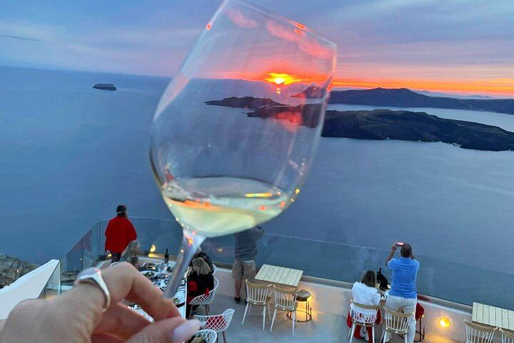 Cheers to another great sunset in Santorini