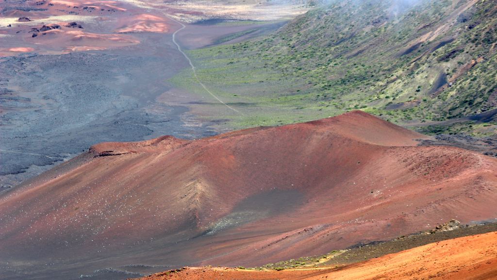 Red cinder cones standing on the floor of the summit valley of Haleakalā National Park, Maui