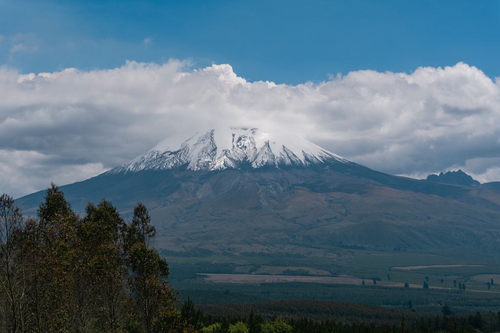 The snow-capped cone of the Cotopaxi volcano rising over the Andean highlands, Ecuador
