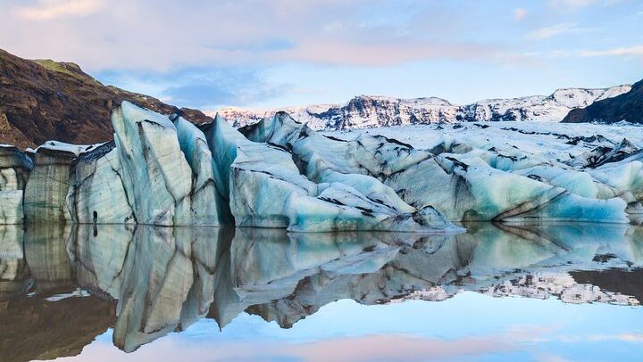 Distinct black ash layers from nearby volcanic eruptions make Sólheimajökull one of Iceland’s most unique glaciers