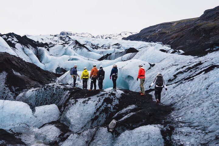 Equipped with crampons and safety gear, guests make their way across dramatic ice ridges and frozen terrain