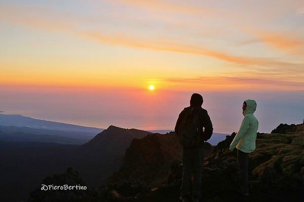 Etna at Sunset: the 10,000-Year-Old Caldera and Houses Ringed by Lava