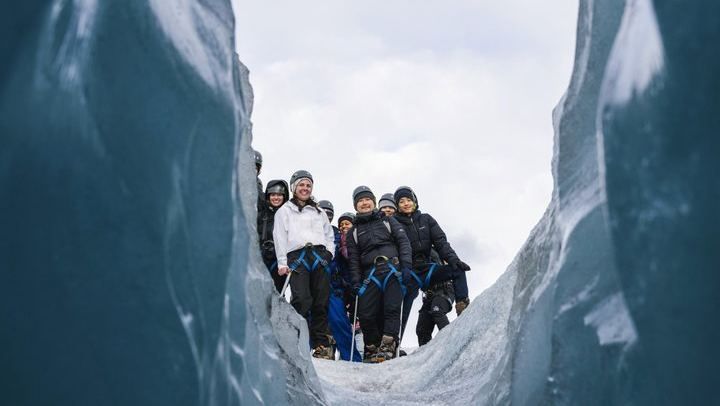 Experience a guided glacier tour featuring ice formations, volcanic ash layers, and unforgettable views near Vik, Iceland