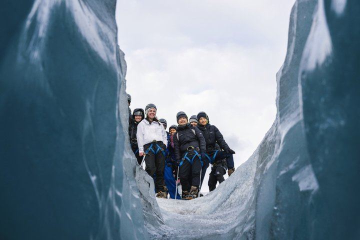 Experience a guided glacier tour featuring ice formations, volcanic ash layers, and unforgettable views near Vik, Iceland