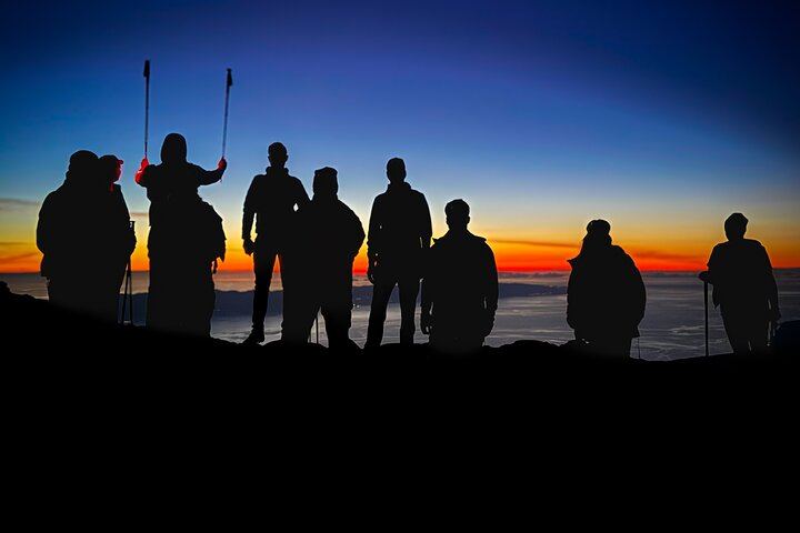 First light after a night climb — unforgettable moments above the clouds.
