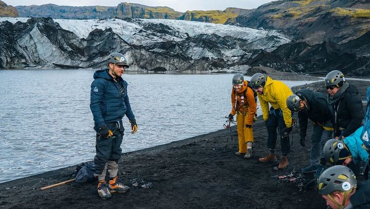 Gearing up with crampons, helmets, and harnesses before stepping on the glacier