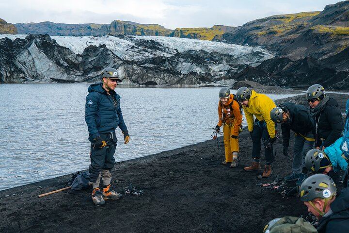 Gearing up with crampons, helmets, and harnesses before stepping on the glacier