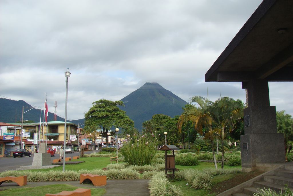 The town of La Fortuna in Costa Rica with the Arenal Volcano rising behind its rooftops