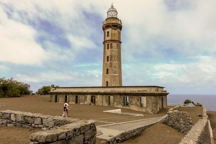 Lighthouse at Ponta dos Capelinhos. It withstood 13 months of volcanic activity. Despite being practically buried and with some damage, it managed to resist without collapsing.