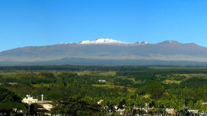 Majestic Maunakea overlooking Hilo bay.