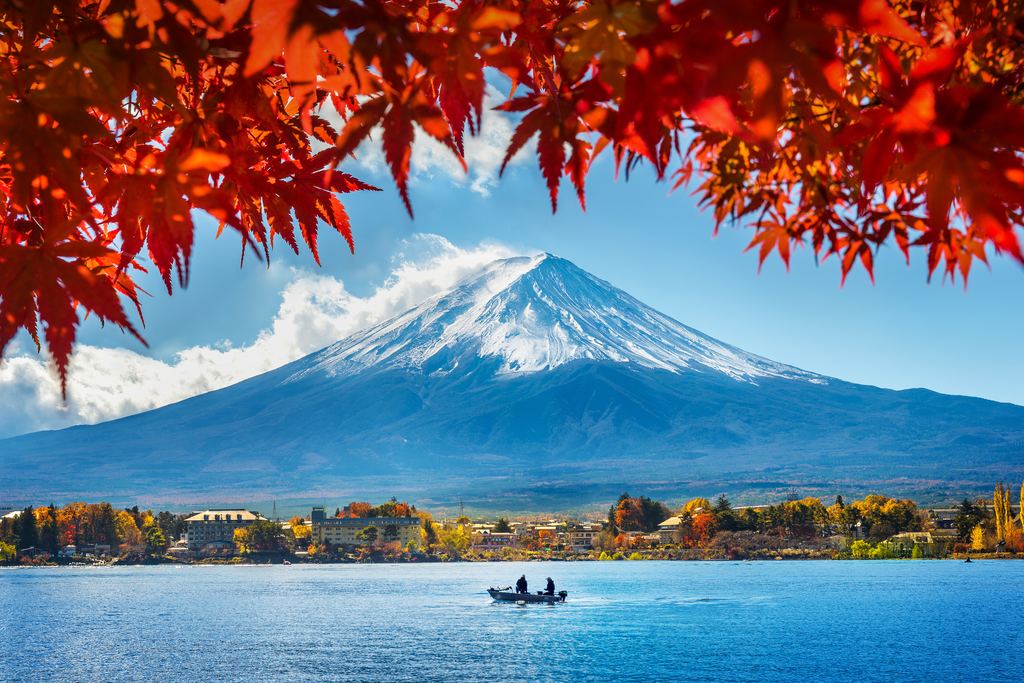 Mount Fuji above Lake Kawaguchiko framed by autumn foliage, Yamanashi, Japan