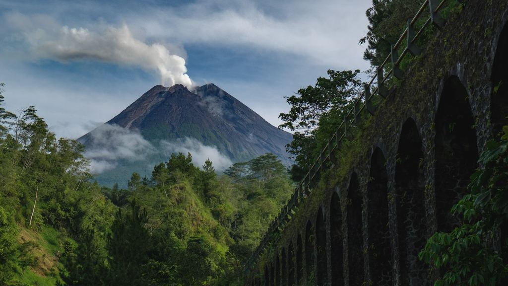 Mount Merapi in eruption in January 2021 seen from the villages on its southern flank
