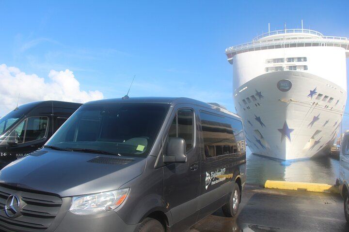Our vans next to a cruise ship in the Port of Hilo.