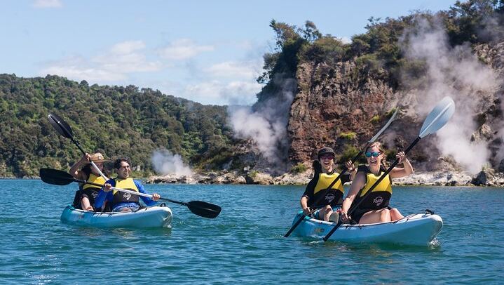 Paddling past the geothermal steaming cliffs