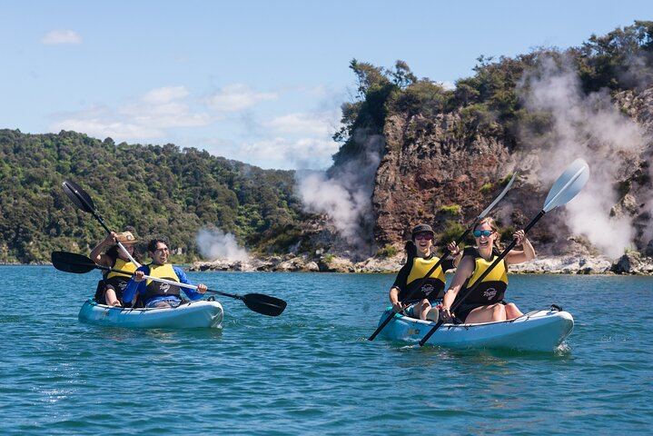 Paddling past the geothermal steaming cliffs