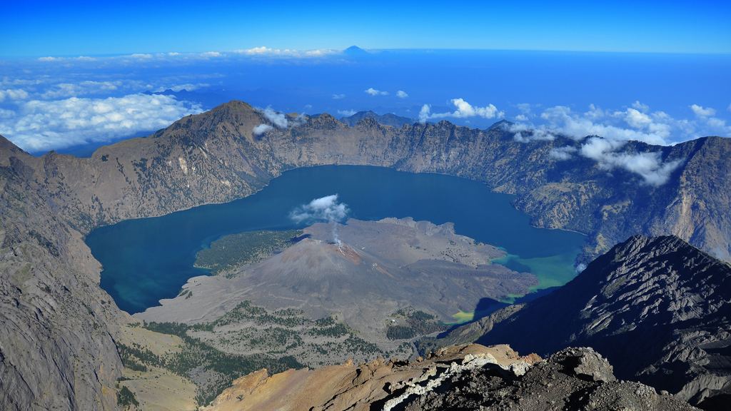 Panorama across the Rinjani caldera with the Segara Anak lake and the Barujari cone below the rim