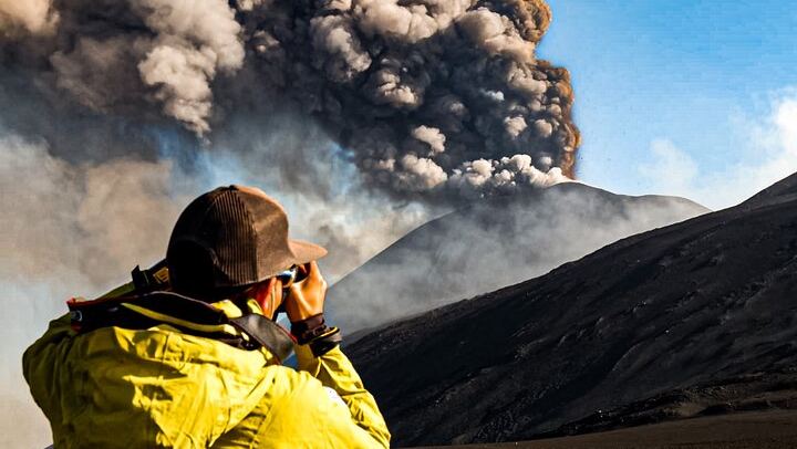 Photographing the explosive activity started at the South East Crater of Etna during the excursion