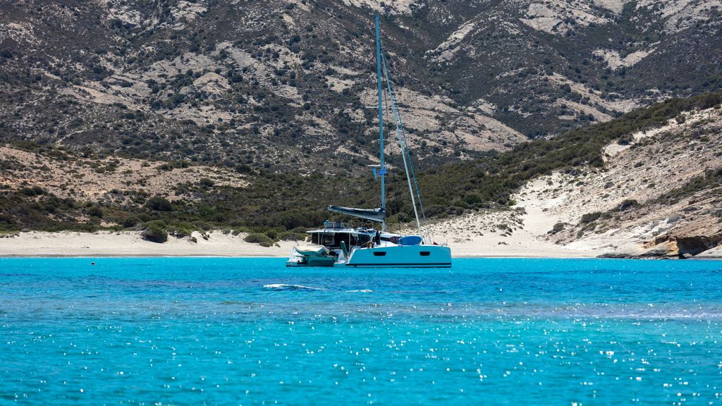 White volcanic rock and clear turquoise water at Polyaigos in the western Cyclades