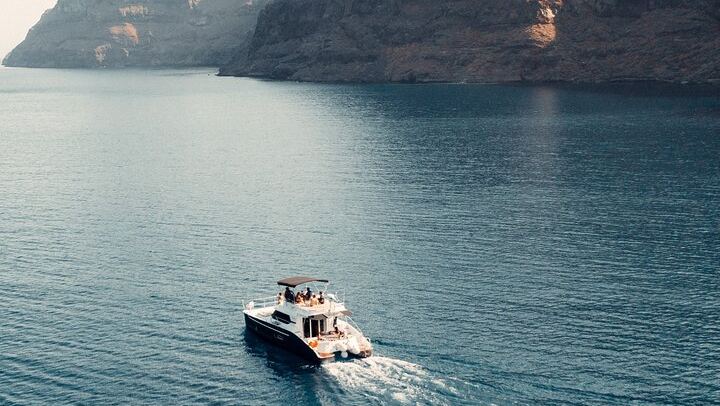 Private Caldera Cruise with Power Catamaran ENJOY incl. Meal & Drinks