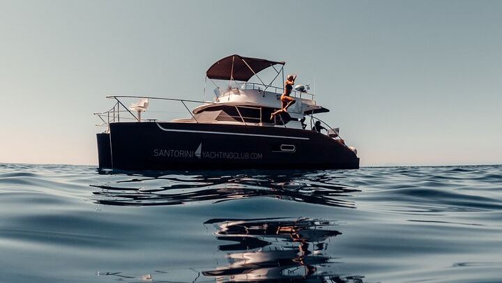 Private Caldera Cruise with Power Catamaran ENJOY incl. Meal & Drinks