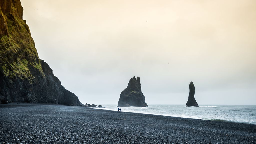 Basalt sea stacks off the black sand beach of Reynisfjara near Vík, southern Iceland