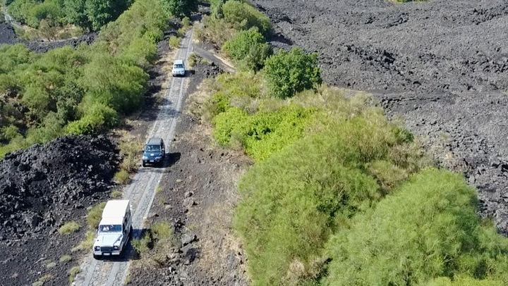Safari jeep on lava flows (1992)