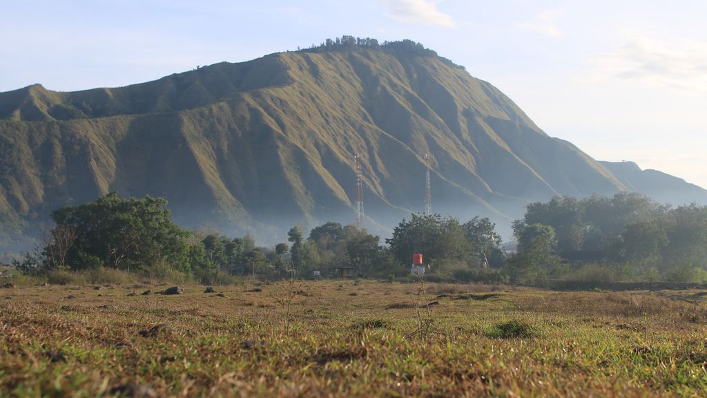 The village of Sembalun and the grass hills below Mount Rinjani, Lombok