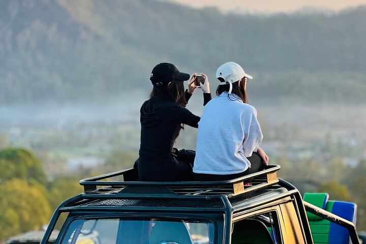Sharing the magic of sunrise together at the top of Mount Batur