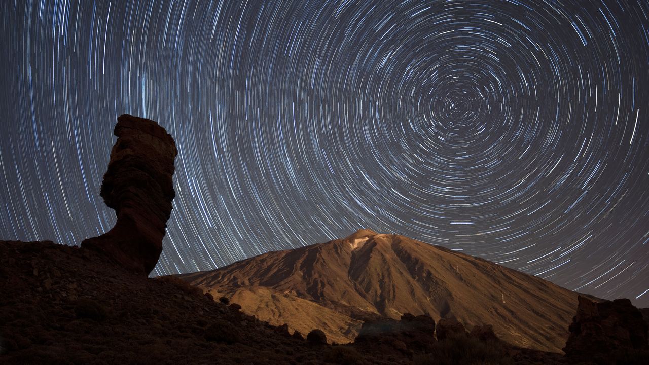 Star trails circling above the Teide volcano in Teide National Park, Tenerife, Canary Islands