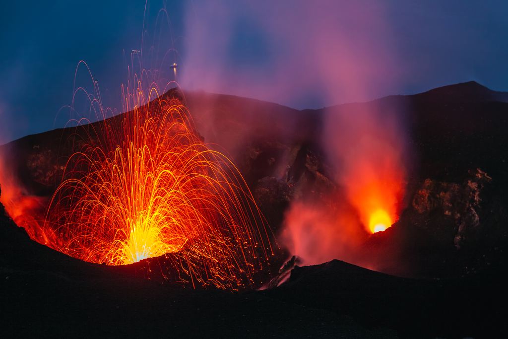 The cone of Stromboli rising from the Tyrrhenian Sea, with a plume of gas above the summit craters