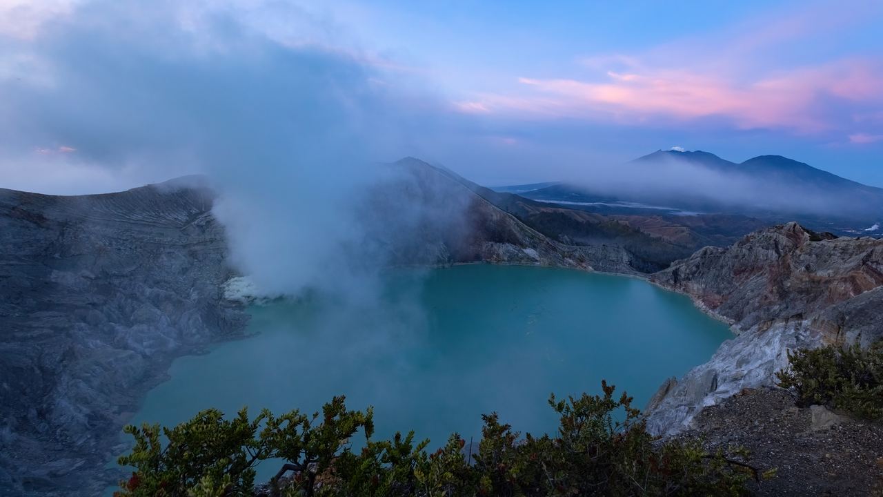Sulphurous smoke rising from the vents beside the acid lake in the Ijen crater, Java, Indonesia