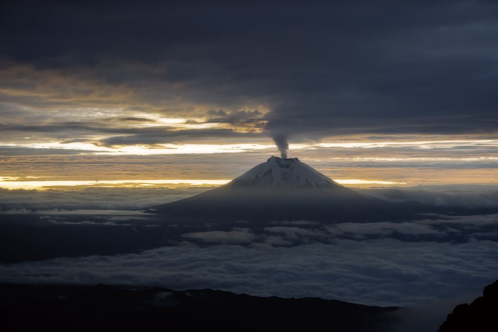 Sunrise over the city of Quito with the Cotopaxi volcano in the background, Ecuador