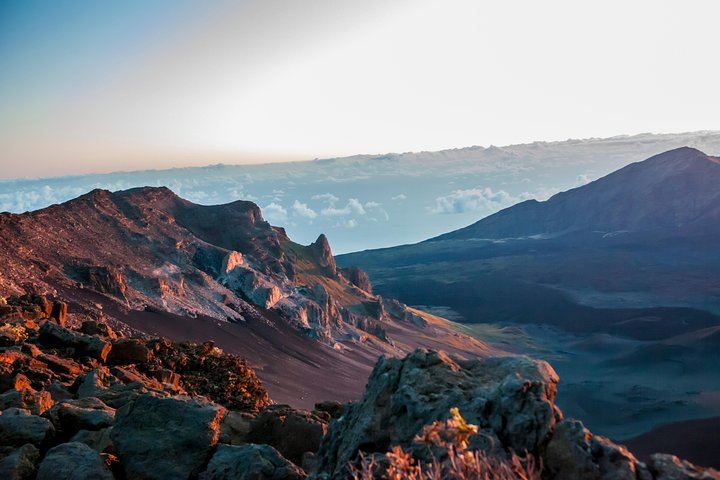 Sunshine illuminates the craggy rocks on Mount Haleakala in Maui's Haleakala National Park.
