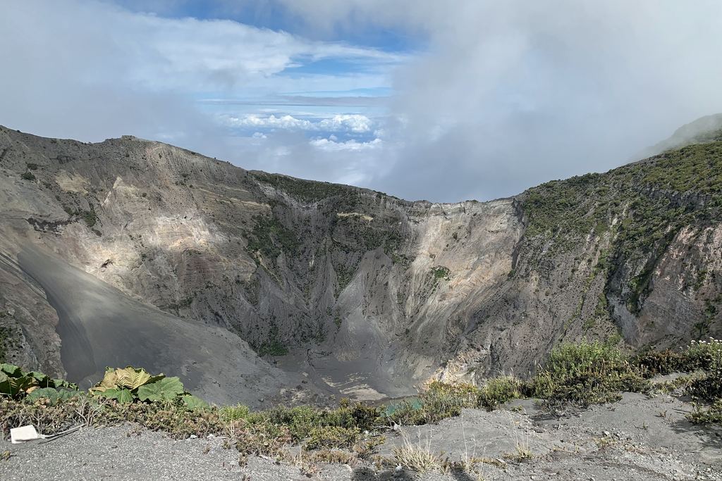 The grey main crater of the Irazú volcano in Costa Rica, seen from the rim path at 3,432 metres