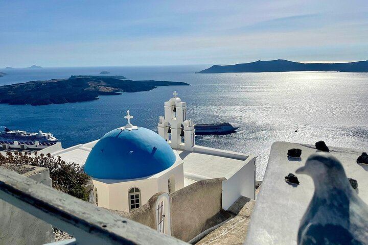 The most iconic view in Fira — blue dome, bell tower, and endless sea. A timeless scene that captures the spirit of Santorini in a single glance.