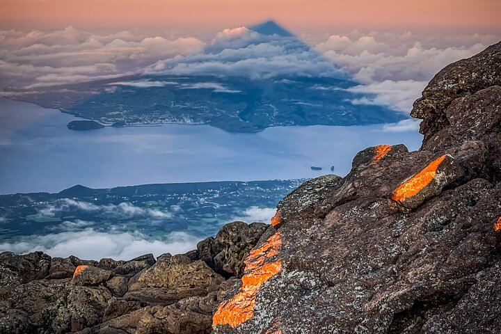 The shadow of Mount Pico painted on the morning sky — a night climb that ends in pure wonder.