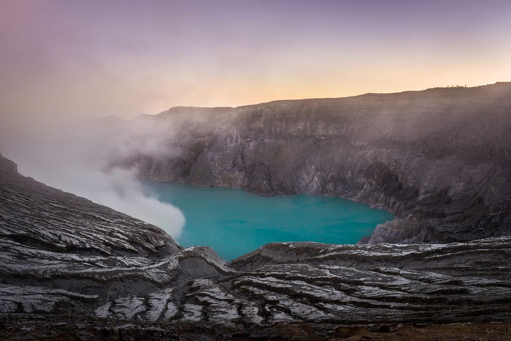 The turquoise acid crater lake of Kawah Ijen seen from the rim, East Java, Indonesia