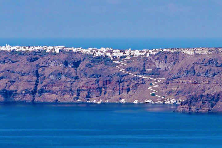 Visit Thirasia Island. A peaceful escape from Santorini's crowds with a serpentine path down to Korfos port & views across the caldera.