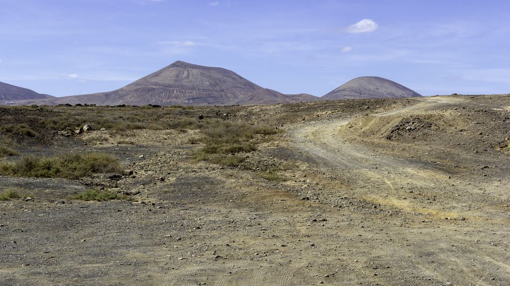 Volcanic hills under a blue sky in Timanfaya National Park, Lanzarote